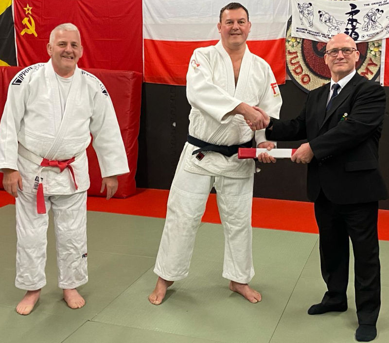 Dermot Heslop presents Danny with red & white belt