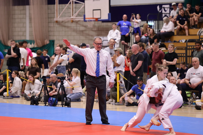 Cameron MacDowall refereeing a Judo match